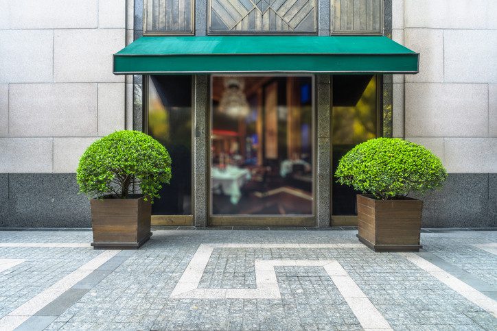 Storefront, manicured trees very pleasing