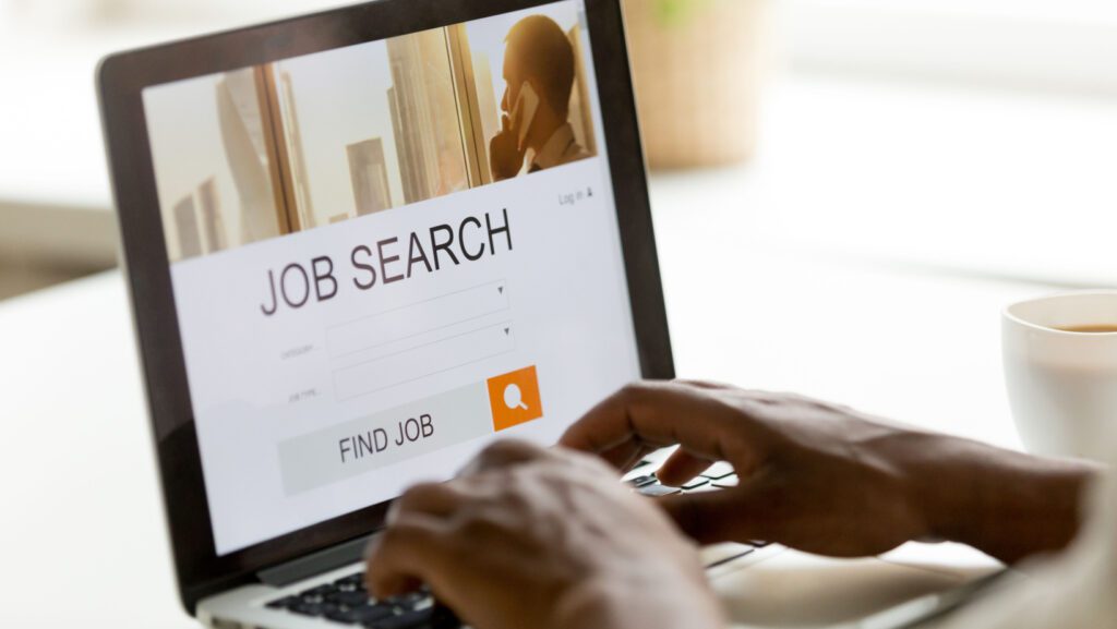 Searching for a job on a computer.