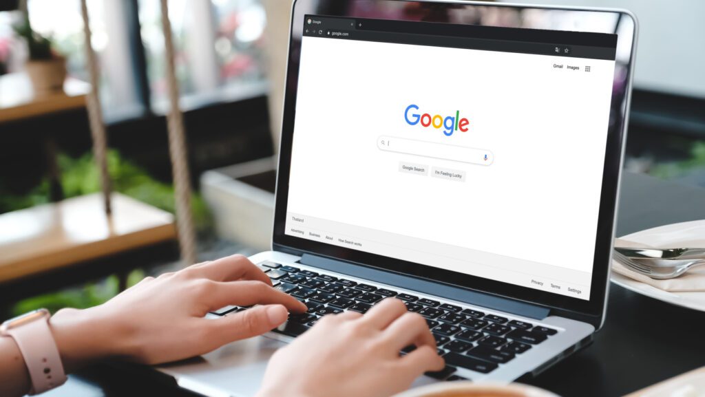 Person doing a Google Search on a laptop computer