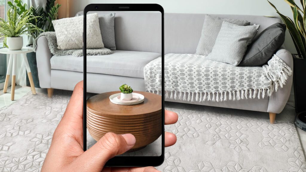 Cell phone taking picture of sofa.